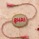 Beautifull handcrafted Green and Silver Embroidered Rakhi with Pink Braded Thread Tassels - Western Era Rakhi for women