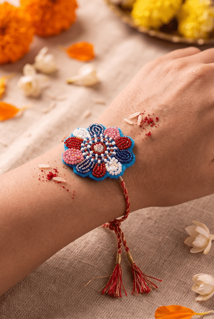 Elegant Floral Beadwork Thread Handcrafted Rakhi - Western Era Rakhi for women