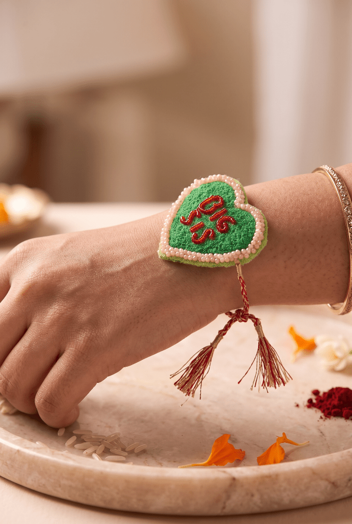 Green Heart Shaped Rakhi with Pink Beadwork - Western Era Rakhi for women