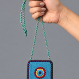 Necklace Featuring A Textured Turquoise Pendant Detailed With Vibrant Thread Embroidery