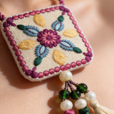 Necklace Featuring Intricate Floral Thread Embroidery In Rich Pink, Teal & Gold Tones With Tassels