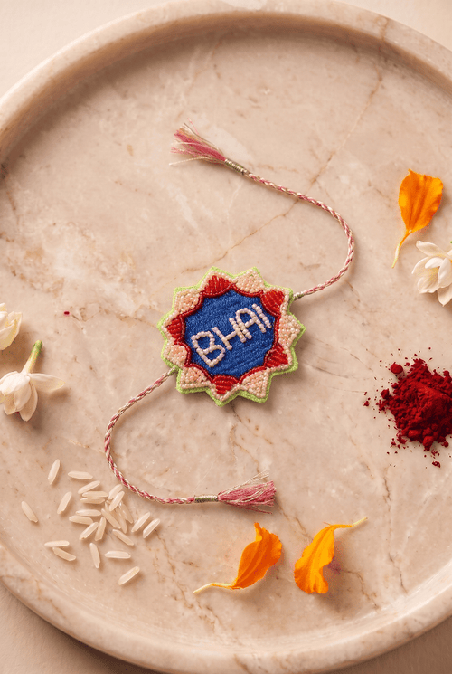 Multicolor Embroidered Details Rakhi with Pink Braided Thread and Tassels