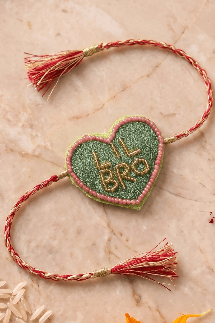 Olive Green Heart Shape Rakhi with Pink Bead Work - Western Era Rakhi for women