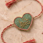 Olive Green Heart Shape Rakhi with Pink Bead Work - Western Era Rakhi for women