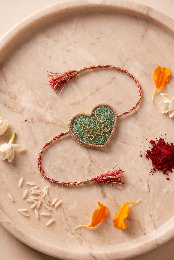 Olive Green Heart Shape Rakhi with Pink Bead Work - Western Era Rakhi for women