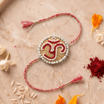 Om Motif Embellished with Red, White, and Golden Beadwork Rakhi - Western Era Rakhi for women