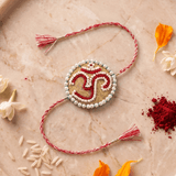 Om Motif Embellished with Red, White, and Golden Beadwork Rakhi - Western Era Rakhi for women