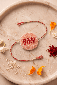 Peach / Red Pleated Rakhi with Bhai Motif - Western Era Rakhi for women