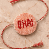 Peach / Red Pleated Rakhi with Bhai Motif - Western Era Rakhi for women