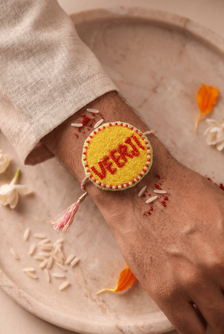 Red Bead Detailing Rakhi with Soft Pink Braided Threads - Western Era Rakhi for women