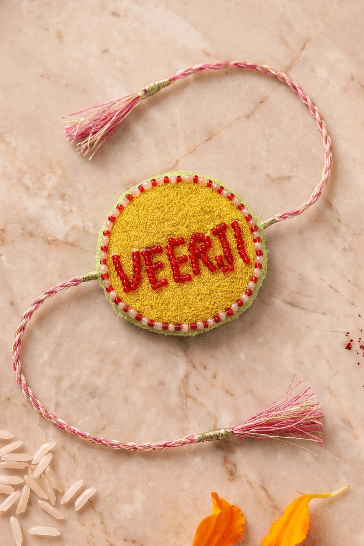 Red Bead Detailing Rakhi with Soft Pink Braided Threads - Western Era Rakhi for women