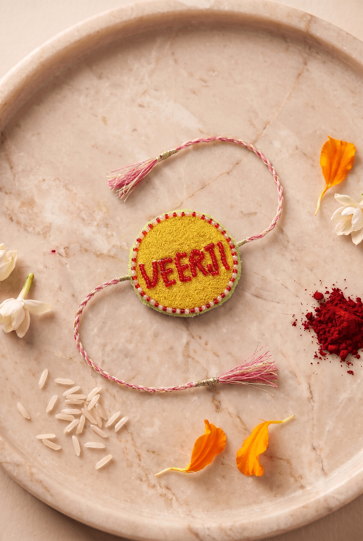 Red Bead Detailing Rakhi with Soft Pink Braided Threads - Western Era Rakhi for women